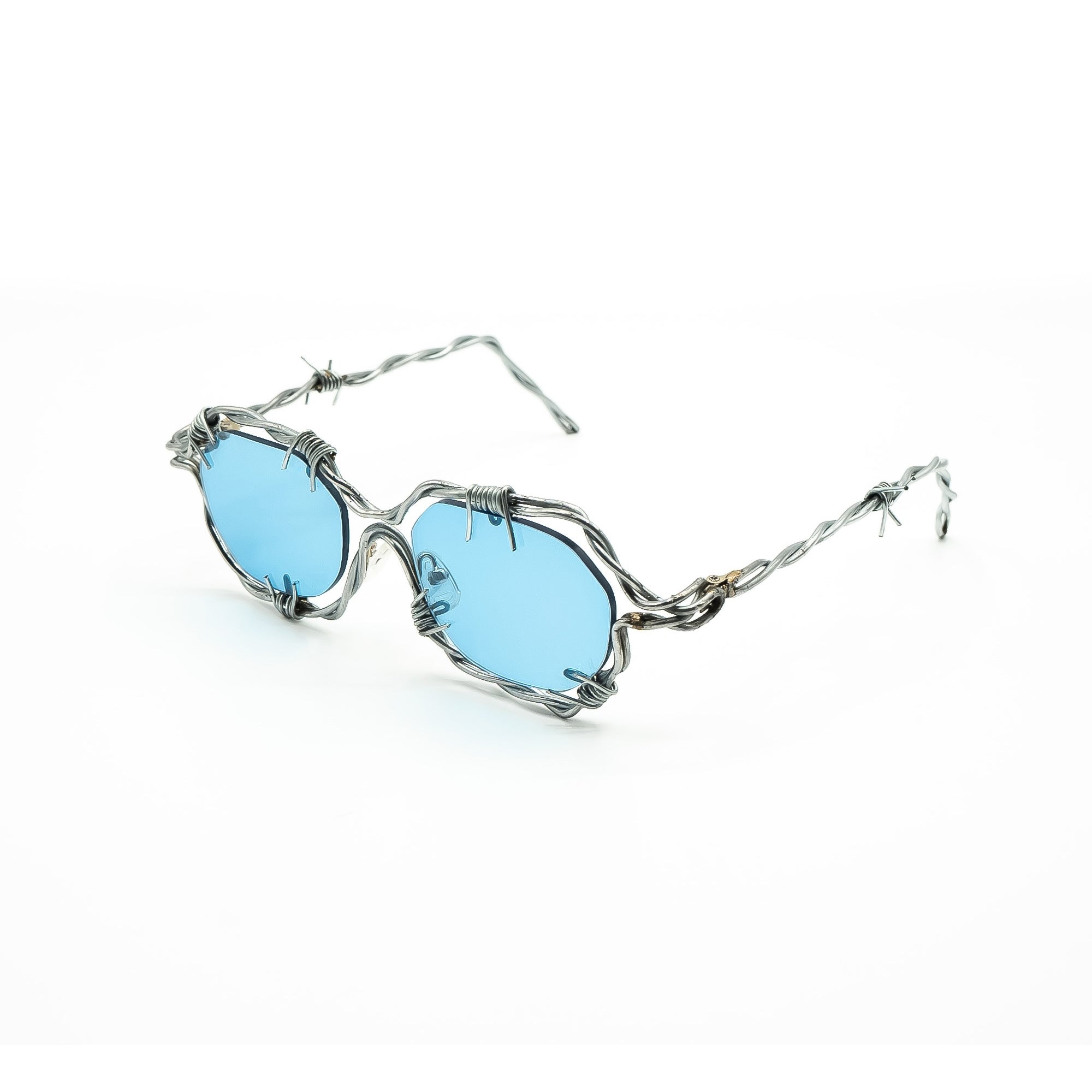 Gafas de diseño hechas a mano con plata y lentes fotocromáticas 