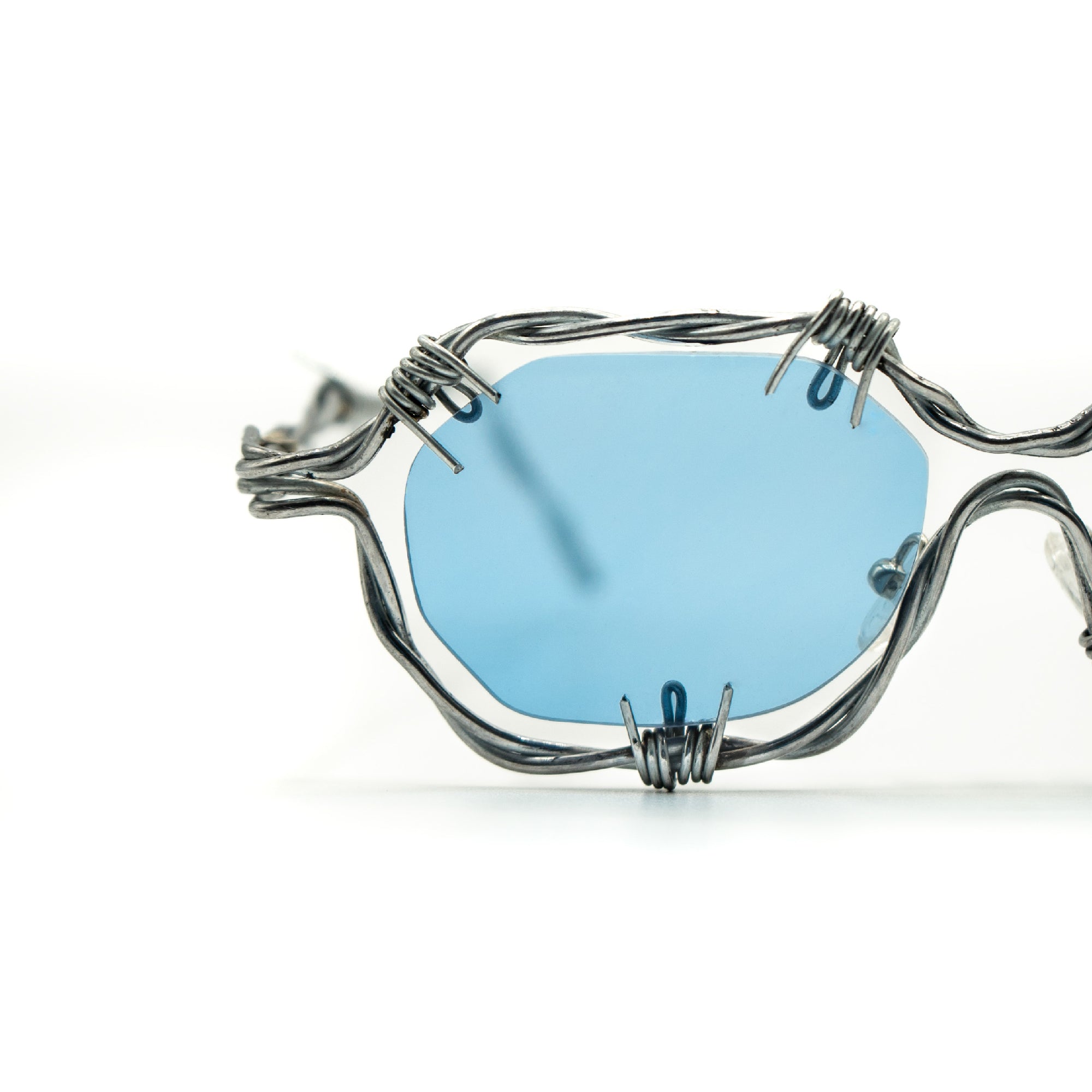 Gafas de diseño hechas a mano con plata y lentes fotocromáticas